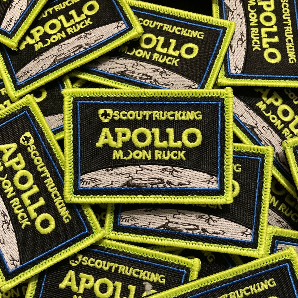 Pile of embroidered tactical patches with the Scout Rucking logo and the words, "Apollo: Moon Ruck."